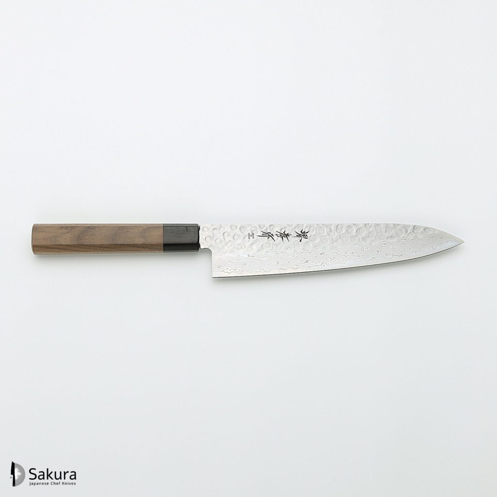 סכין שף יפנית Gyuto רב תכליתית עם ידית עץ ולהב נירוסטה 45 שכבות דמשק AUS10. הוא כולל דמויות חרוטות, ממותגות "סאקורה" בפינה השמאלית התחתונה. סכין שף יפנית Gyuto רב תכליתית עם ידית עץ ולהב נירוסטה 45 שכבות דמשק AUS10. הוא כולל דמויות חרוטות, ממותגות "סאקורה" בפינה השמאלית התחתונה.